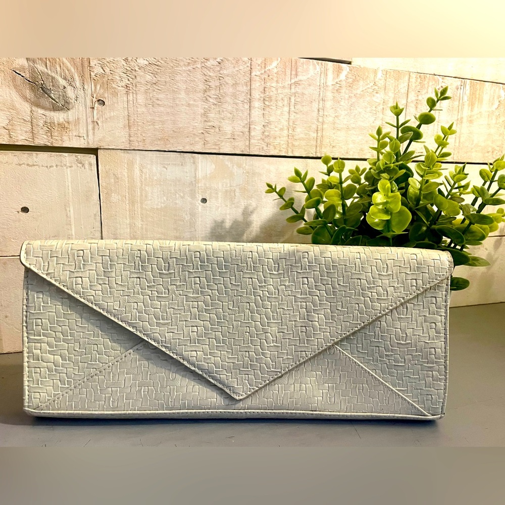 Great clutch- fits nicely under your arm. Won’t slip away!